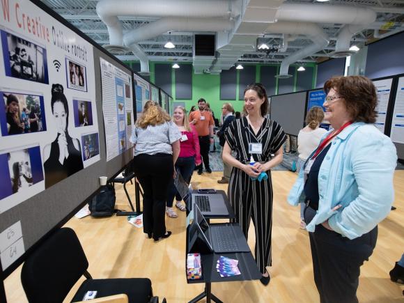 Communication student presenting research and undergraduate research event.