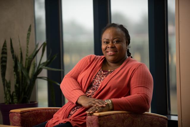 ABA student smiling in campus library