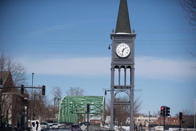 Westfield, MA clock tower with green bridge behind it.