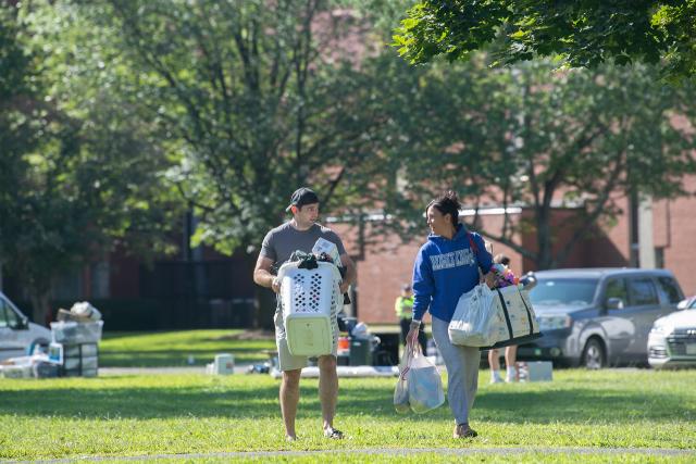 Two students moving in on Move-In Day.