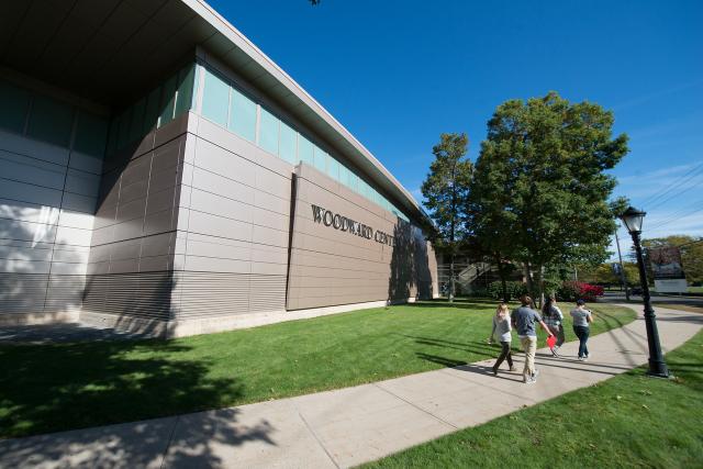 Exterior of Woodward Center with students walking in front of it.