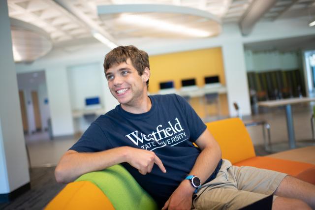 Communication student smiling wearing a WSU shirt.