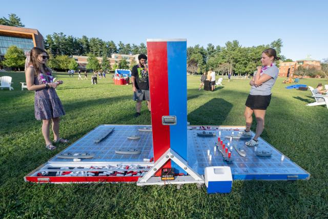 Students playing a game on the campus green during Welcome Week.