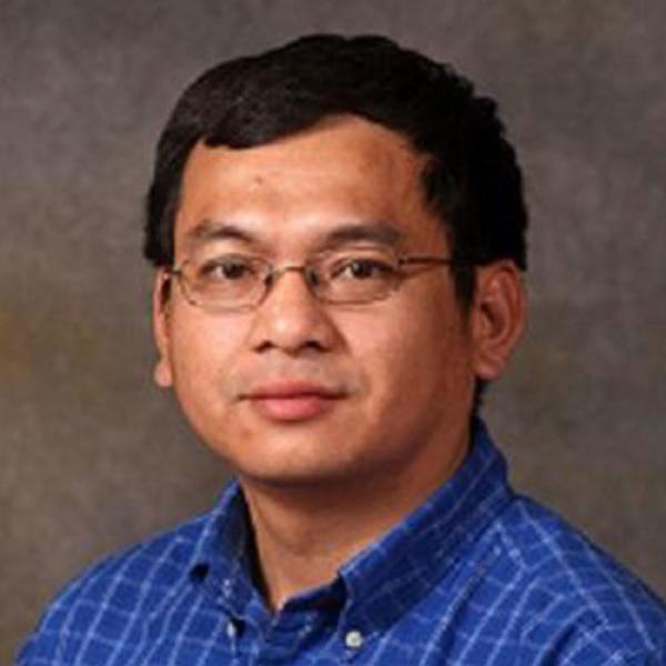 Dr. Liam Nguyen, Chair of the Accounting and Finance Department at Westfield State University, poses for a professional photo.