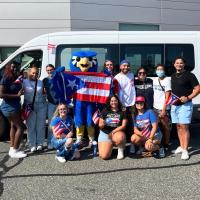 Westfield State students pose with the mascot Nestor at the Puerto Rican Day parade in Springfield MA