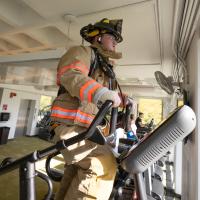 Firefighter on a stair master to honor the firefighters who lost their lives on 911.